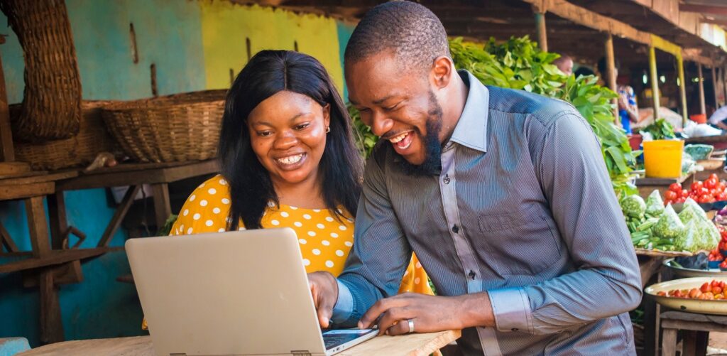 Woman and man on computer, innovative procurement